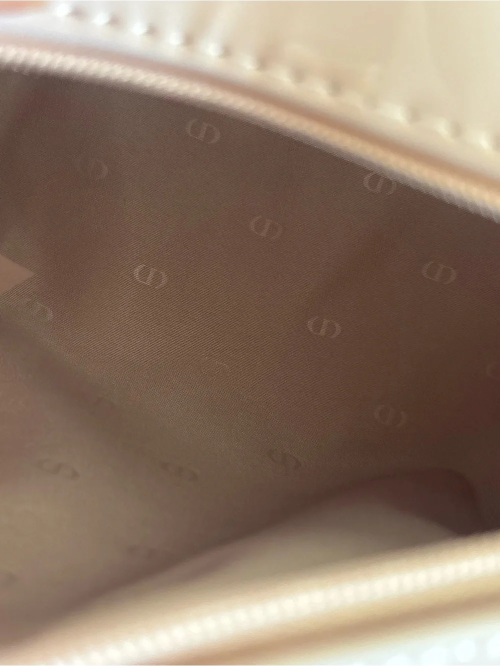 Dior beauty light pink glossy cosmetic bag with embossed CD logo